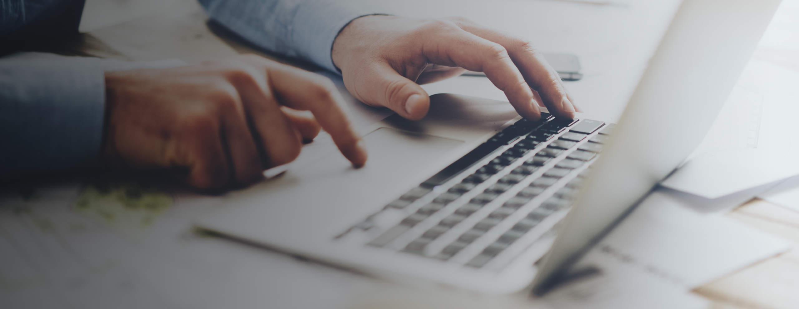 person typing on laptop